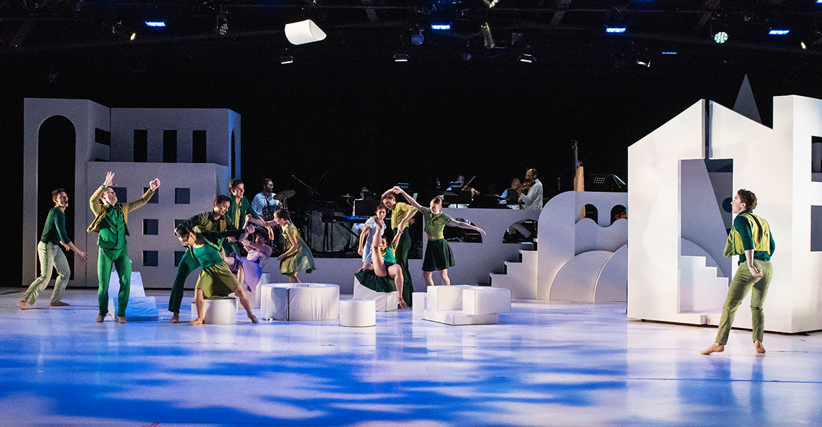 Wonderbound dancers performing on a Robbins dance floor during a contemporary dance performance