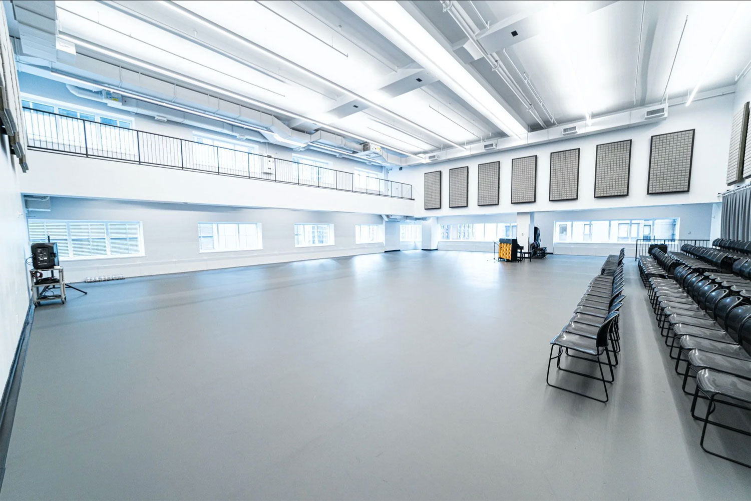 Large performance rehearsal space featuring a Robbins L-Evate™ Premium sprung dance floor with seating and natural daylight