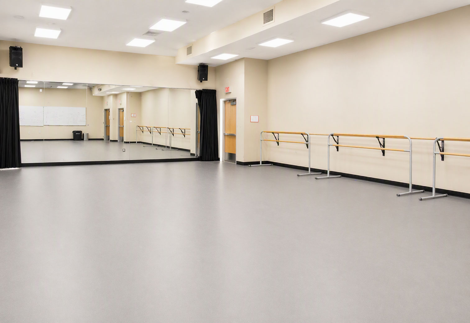 Precision Marley dance floor in a professional ballet studio with mirrored walls and ballet barres