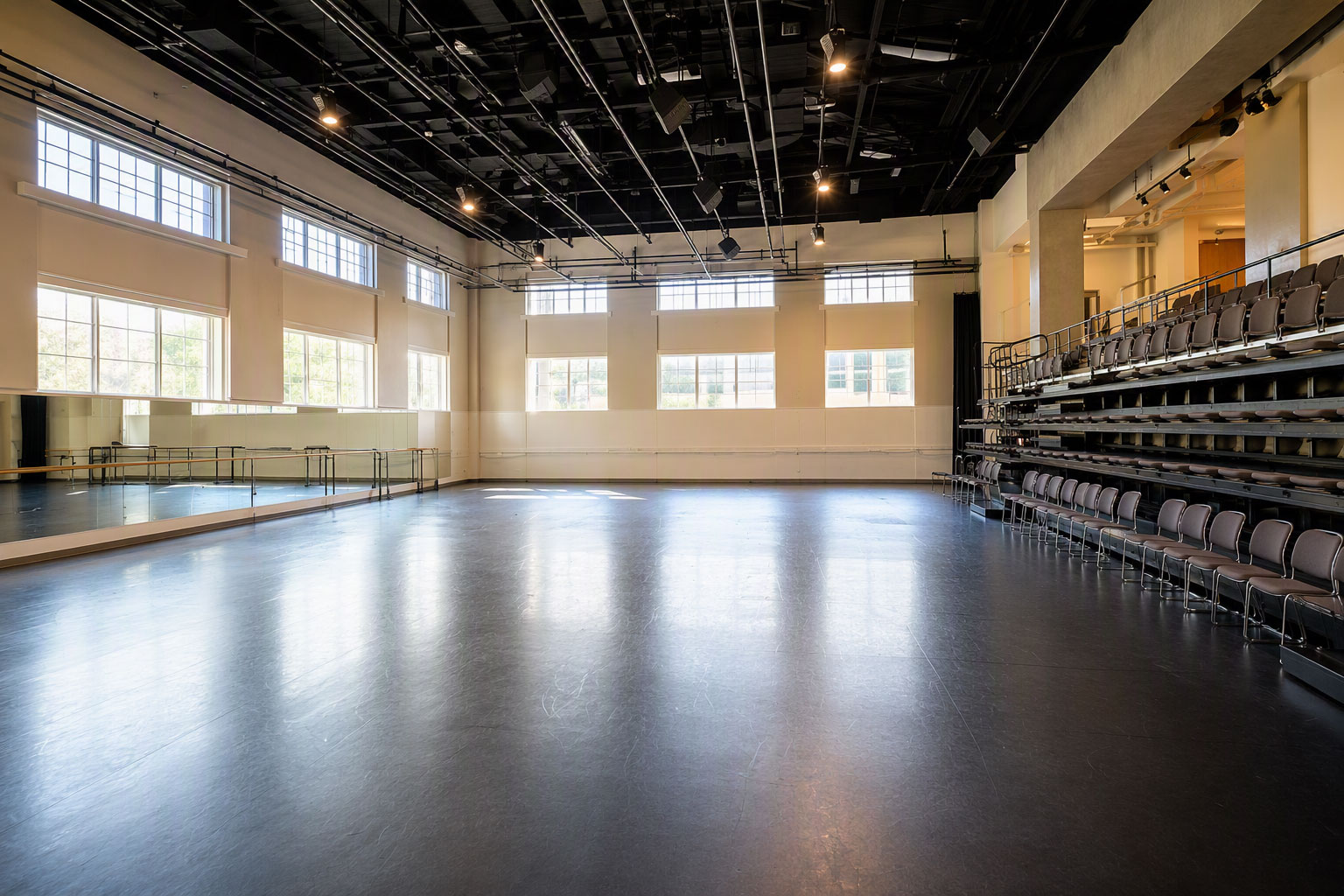 Univerity-space-TCU-modified-w Professional dance rehearsal and performance venue featuring a Robbins sprung dance floor with integrated seating, mirrors and performance lighting at Texas Christian University (TCU)